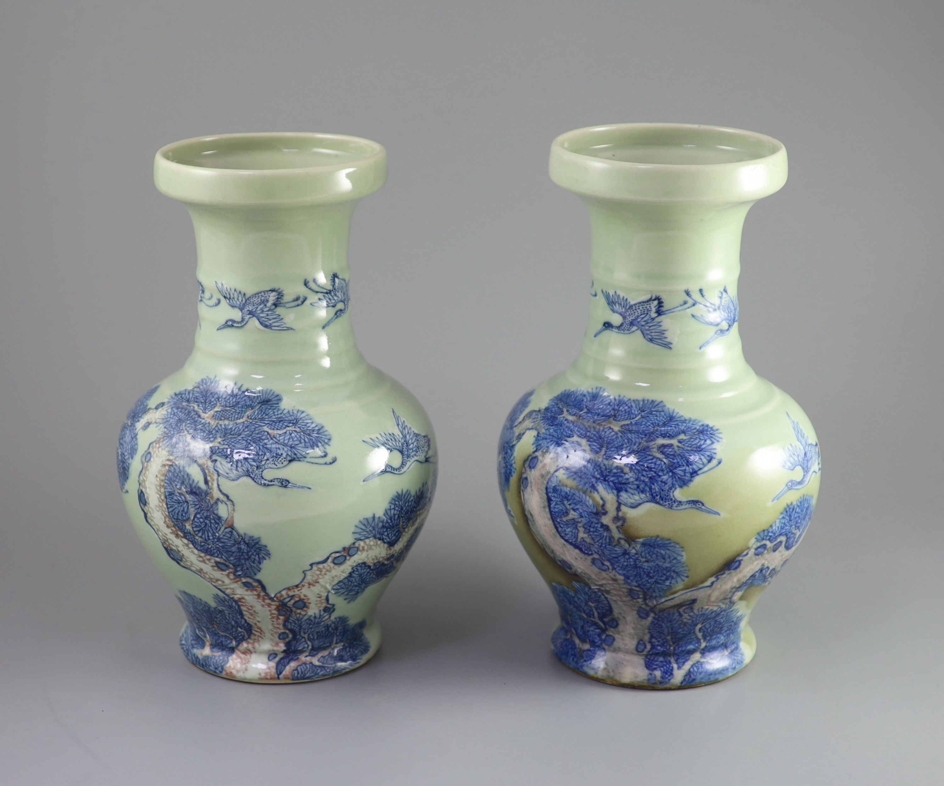 A pair of Chinese underglaze blue and copper red celadon ground vases, probably Republic period 31.5 and 32 cm high